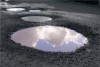 Dorset 'needs town planning job to fix potholes'